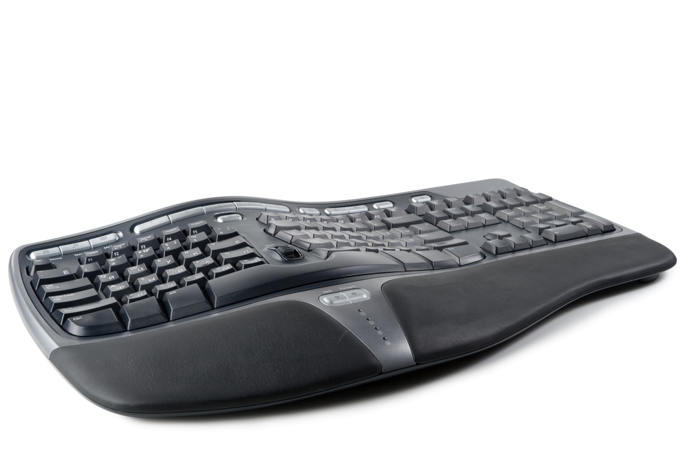 Modern,Black,Ergonomic,Computer,Keyboard,On,A,White,Background.
